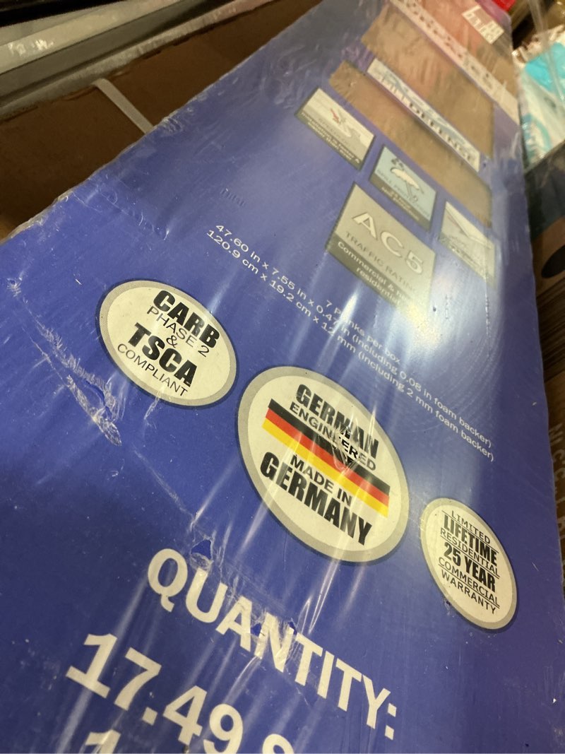 Condition photo showing New/Like New for select surfaces victoria spilldefense laminate flooring, 17.49 sq. ft. per box