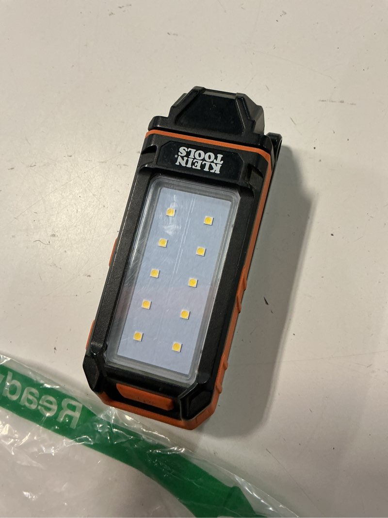 Condition photo showing Good Condition for klein tools 56403 led light, rechargeable flashlight/worklight with kickstand, magnetic mount, and carabiner, charges small electronics, for work, camping work light with charger