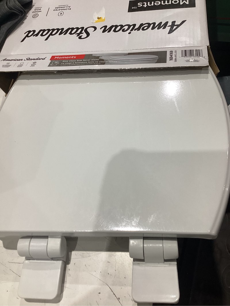 Condition photo showing Good Condition for american standard moments wood white elongated soft close toilet seat