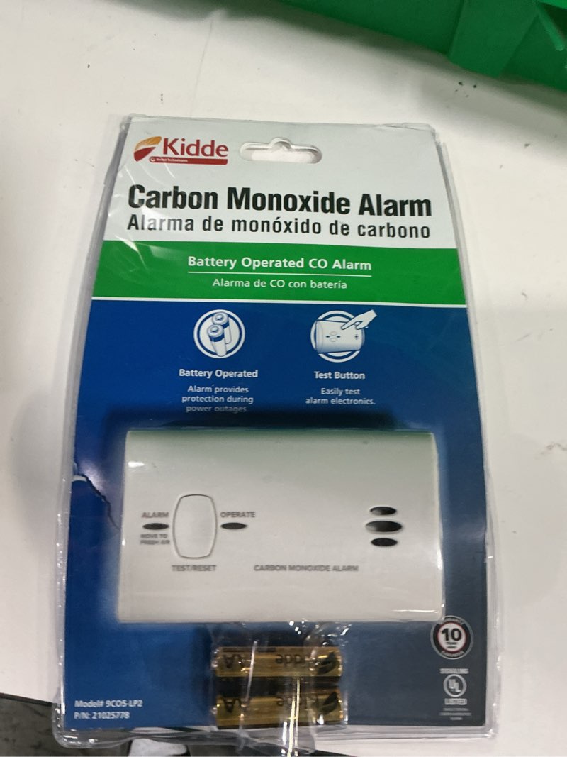 Condition photo showing New/Like New for kidde carbon monoxide detector, battery powered co alarm with leds, test-reset button, low battery indicator, portable clamshell packaging