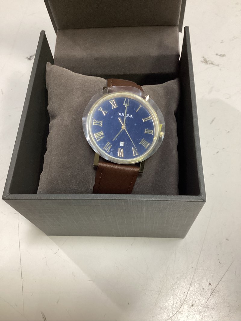 Condition photo showing Good Condition for men's bulova classic gold-tone strap watch with blue dial (model: 97b177)