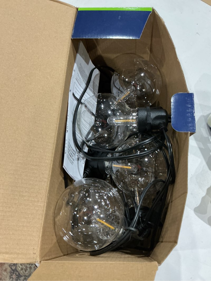 Condition photo showing As Is for harbor breeze 24-ft plug-in black outdoor string light with 12 led globe bulbs