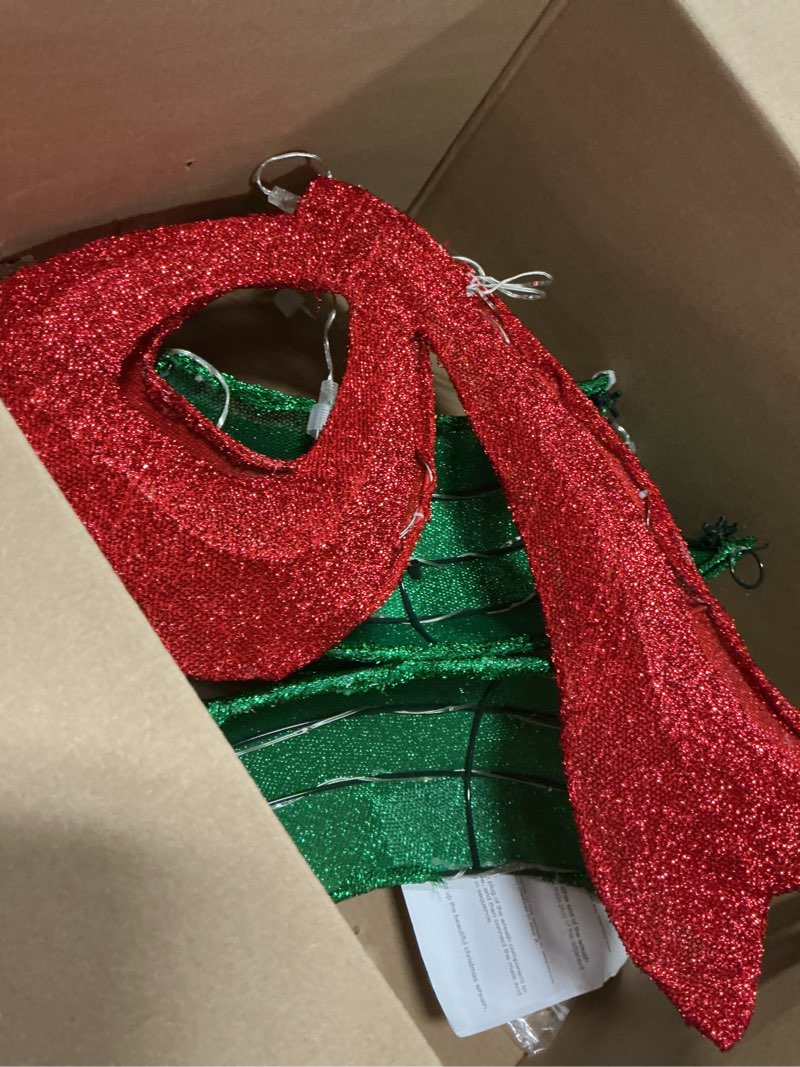 Condition photo showing As Is for 24" 40 LED Lighted Red Sparkly Bow Christmas Decoration…