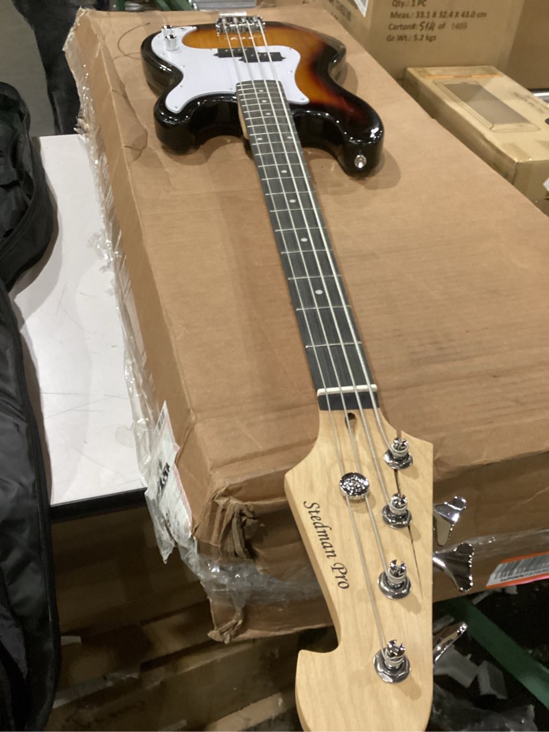 Condition photo showing As Is for Crack in wood Stedman Pro Beginner Series Bass Guitar Bundle with 15-Watt Amp, Gig Bag, Instrument Cable, Strap, Picks, and Polishing Cloth - Sunburst