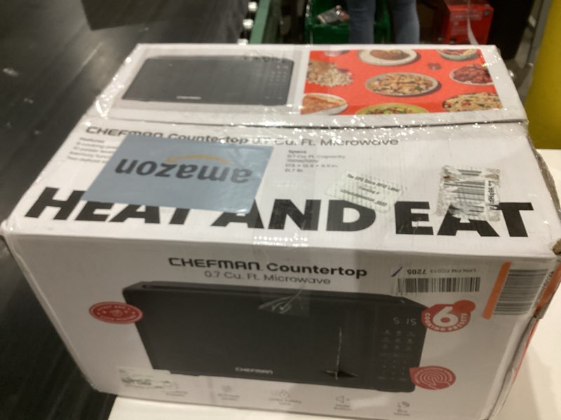 Condition photo showing As Is for Chefman Countertop Microwave Oven 0.7 Cu. Ft., 700 Watts with 10 Power Levels, 6 Cooking Presets with One-Touch Express Cook, Eco Mode, Child Safety Lock, & Mute Button - Black