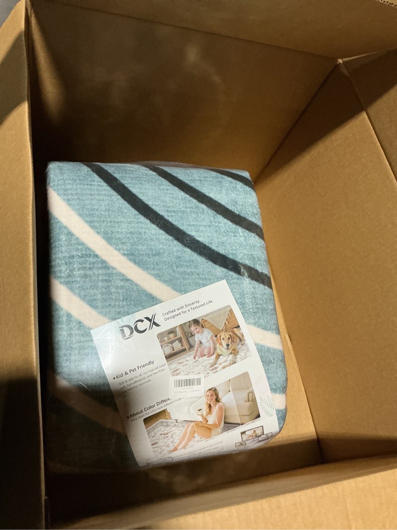Condition photo showing New/Like New for dcx machine washable area rug 9x12, mid century modern non slip stain resistant rug 9x12 for living room, playroom, dining room, soft low pile large carpet, blue & yellow 9' x 12' (rectangular) yellow & blue