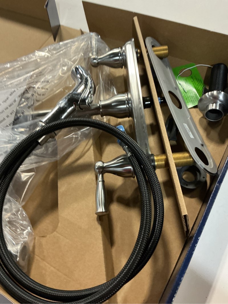 Condition photo showing As Is for project source brice stainless steel double handle kitchen faucet (deck plate and side spray included)