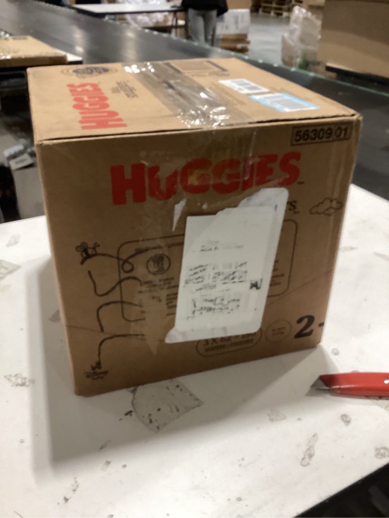 Condition photo showing New/Like New for huggies size 2 diapers, little snugglers baby diapers, size 2 (12-18 lbs), 186 count (3 packs of 62), packaging may vary