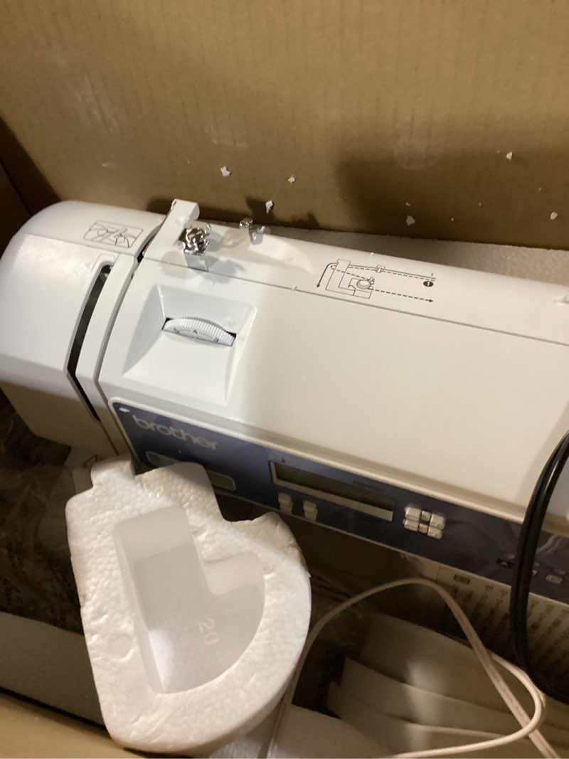 Condition photo showing As Is for brother xr9550 sewing and quilting machine, computerized, 165 built-in stitches, lcd display, wide table, 8 included presser feet, white 20x12x17
