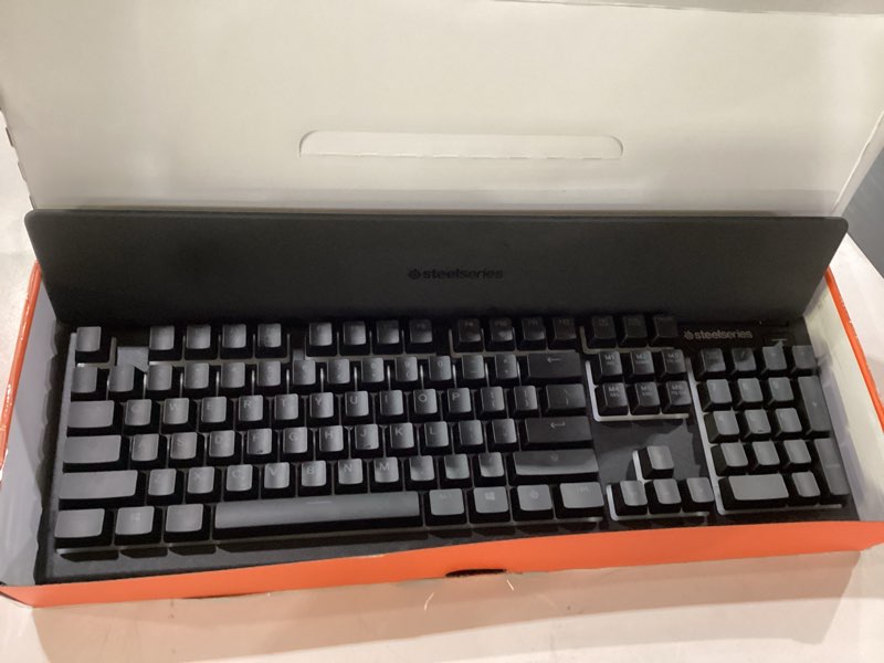 Condition photo showing New/Like New for SteelSeries Apex 3 RGB Gaming Keyboard – 10-Zone RGB Illumination – IP32 Water Resistant – Premium Magnetic Wrist Rest (Whisper Quiet Gaming Switch) Black Apex 3 Whisper Quiet – Tactile & Silent