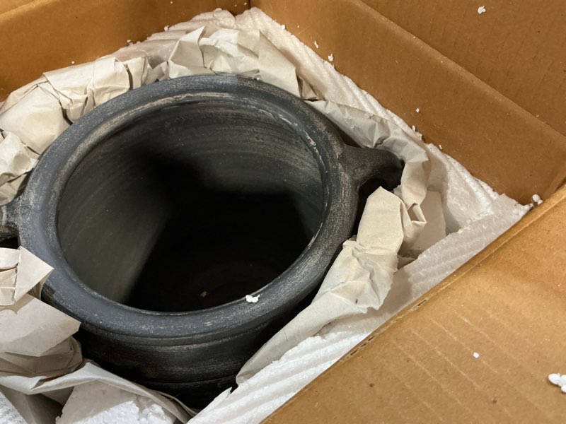 Condition photo showing As Is for Signature Design by Ashley Meadie Casual Indoor Distressed Terra Cotta Vase with Wide Mouth and Handle, Black Black Handles