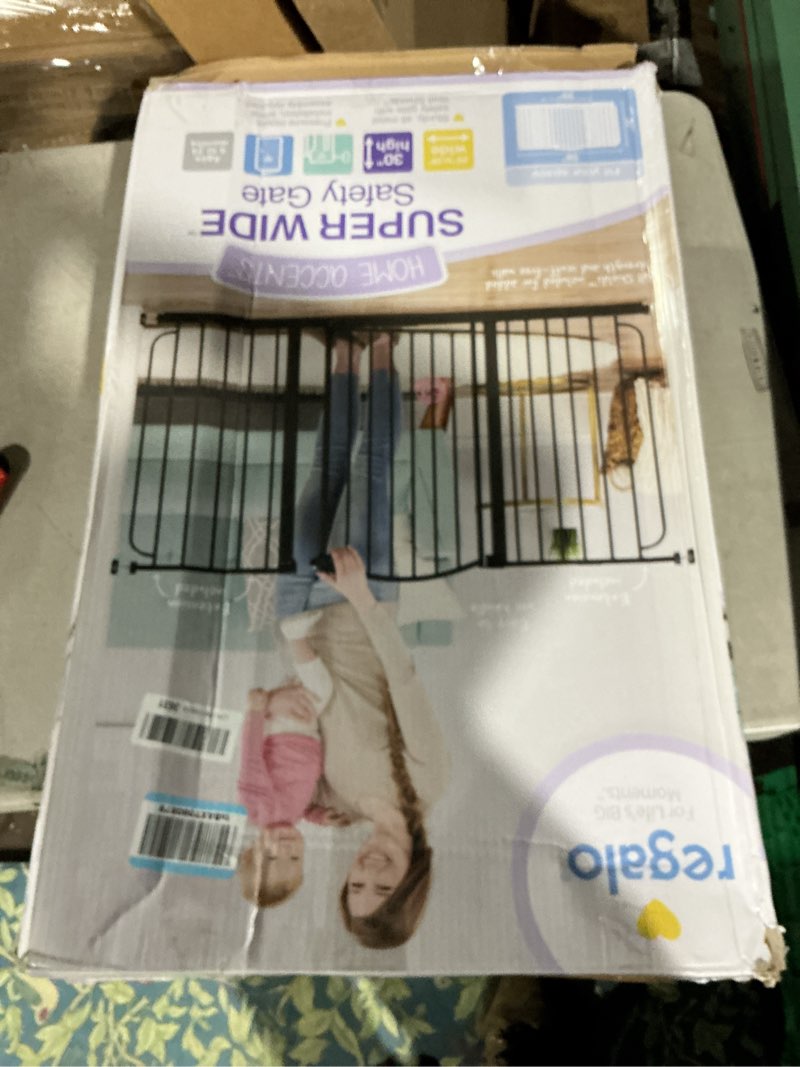 Condition photo showing Good Condition for Regalo 58-Inch Easy Step Extra Tall Arched Décor Walk Thru Baby Gate, Award Winning Brand, Includes 4-Inch Extension Kit, 4 Pack Pressure Mount Kit and 4 Pack Wall Mount Kit, Bronze Black - 29-58"w X 30"h