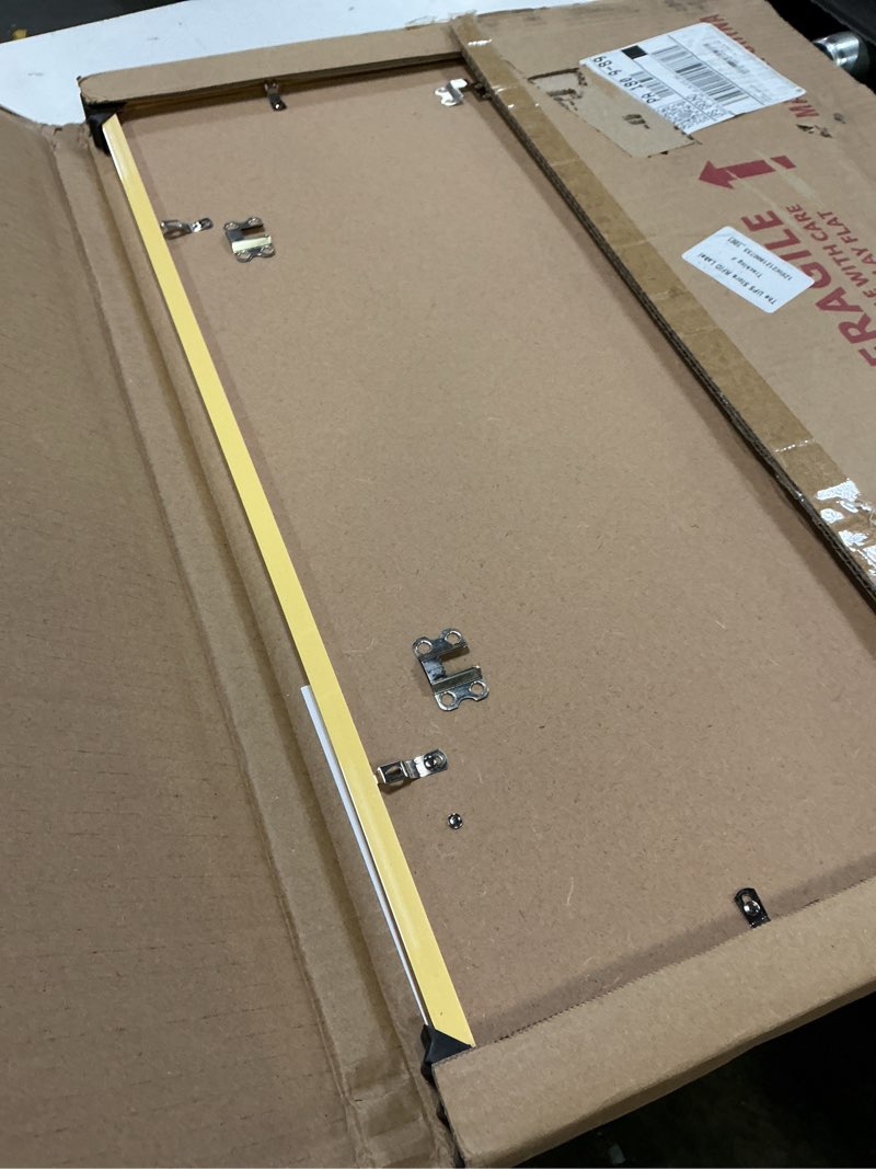 Condition photo showing Good Condition for lavie home 18x24 picture frame for wall display, 18x24 gold picture frame with hd plexiglas, 18 x 24 poster frame 1 pack, display frame for vertical or horizontal, classic collection gold 18x24 1