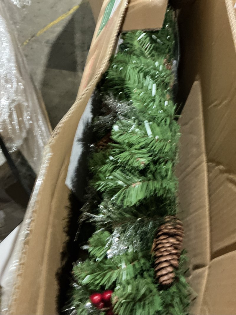 Condition photo showing Good Condition for national tree company 9 ft pre-lit crestwood spruce artificial christmas garland, christmas decoration with glitter, pinecones, red berries, 50 clear lights, 180 tips, green plug in tree