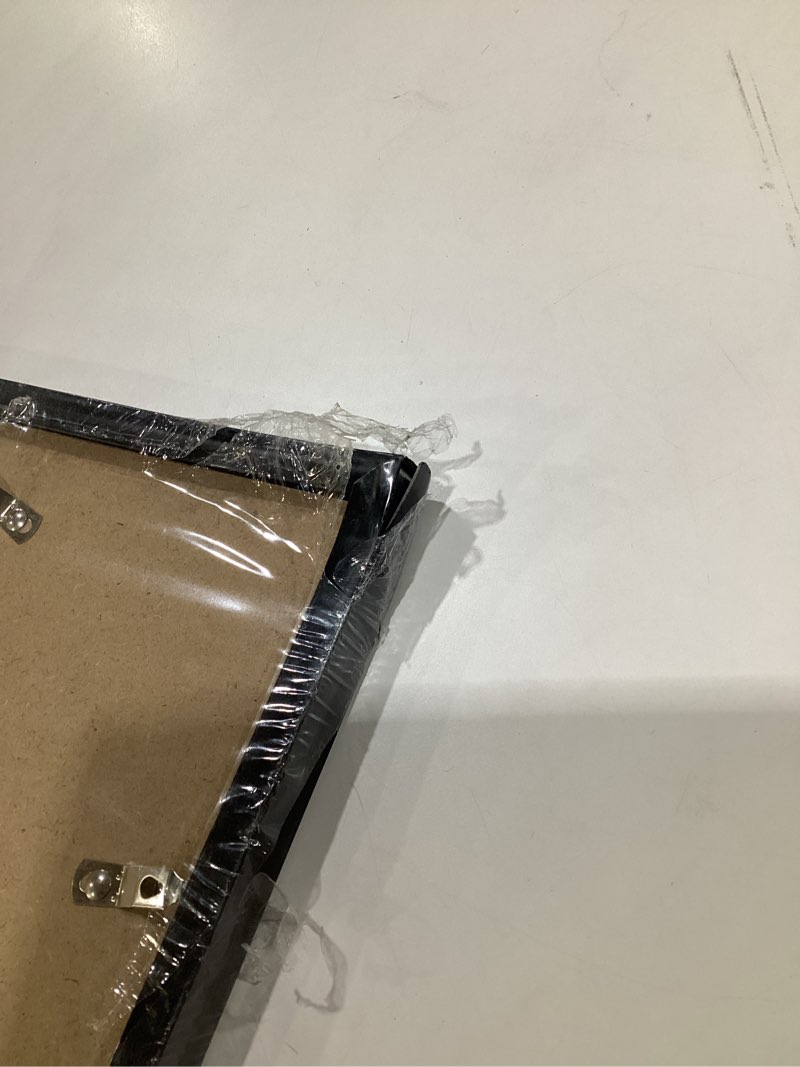 Condition photo showing As Is for MENNTHUI 16.5x23.4(A2) Black Picture Frame, Wall Mounting Horizontally or Vertically, Decoration for Photos, Paintings, Posters, Artwork, CORNER IS DAMAGED
