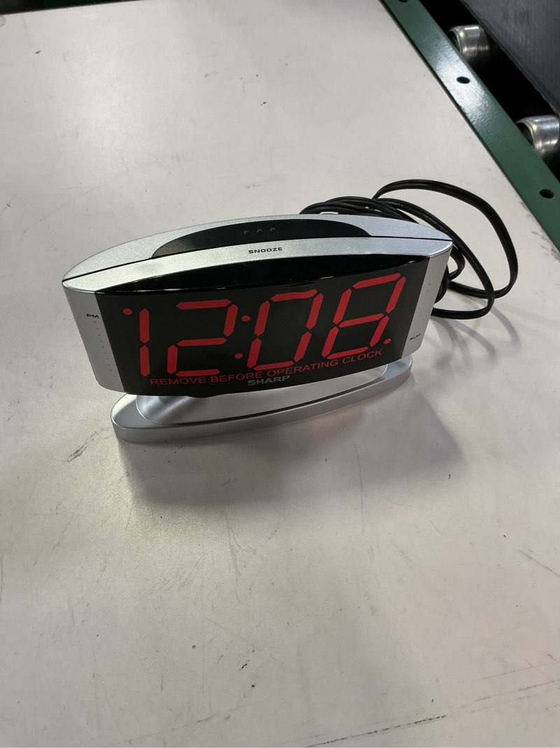 Condition photo showing As Is for sharp home led digital alarm clock – swivel base - outlet powered, simple operation, alarm, snooze, brightness dimmer, big red digit display, gun metal silver  case
