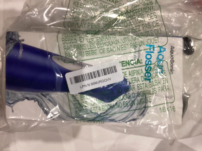 Condition photo showing New/Like New for AquaSonic Water Flosser - Cordless Rechargeable Water Flossers for Teeth Cleaning - Waterproof Aqua Flosser, Portable Oral Irrigator for Dental Cleaning with 5 Jet Tips – Braces Home Travel Sapphire Blue