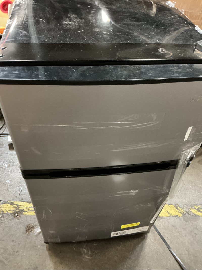 Condition photo showing As Is for arctic king arm32d5asl 3.2 cu ft compact fridge - stainless steel