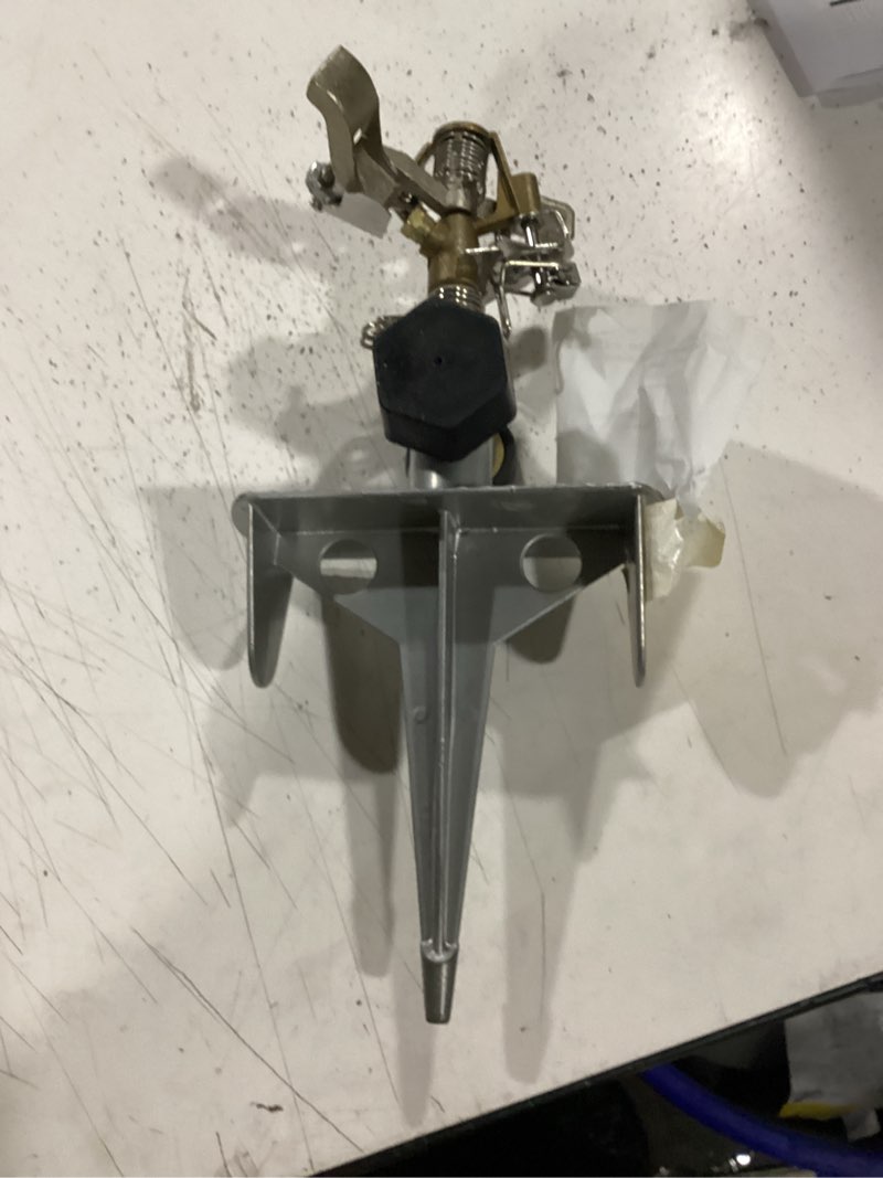 Condition photo showing As Is for orbit sprinkler