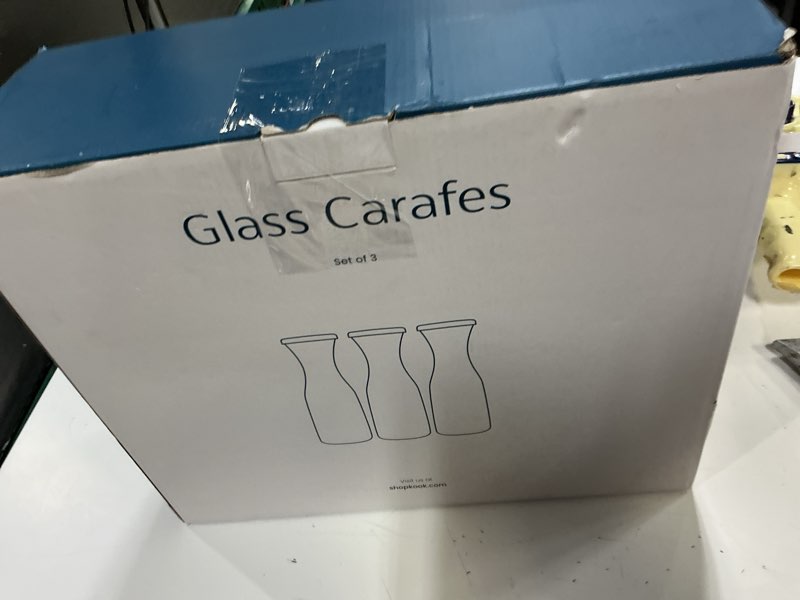 Condition photo showing New/Like New for kook glass carafe pitchers, beverage dispensers, clear jugs for mimosa bar, water, wine, milk and juice, with plastic lids, dishwasher safe, 35 oz, set of 3