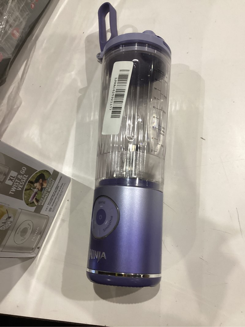 Condition photo showing As Is for ninja blast max, portable blender + twist & go, personal smoothie, blend, ice crush, 3 programs, cordless, 22 oz removable vessel, dishwasher safe, leakproof, lavender, bc251ld