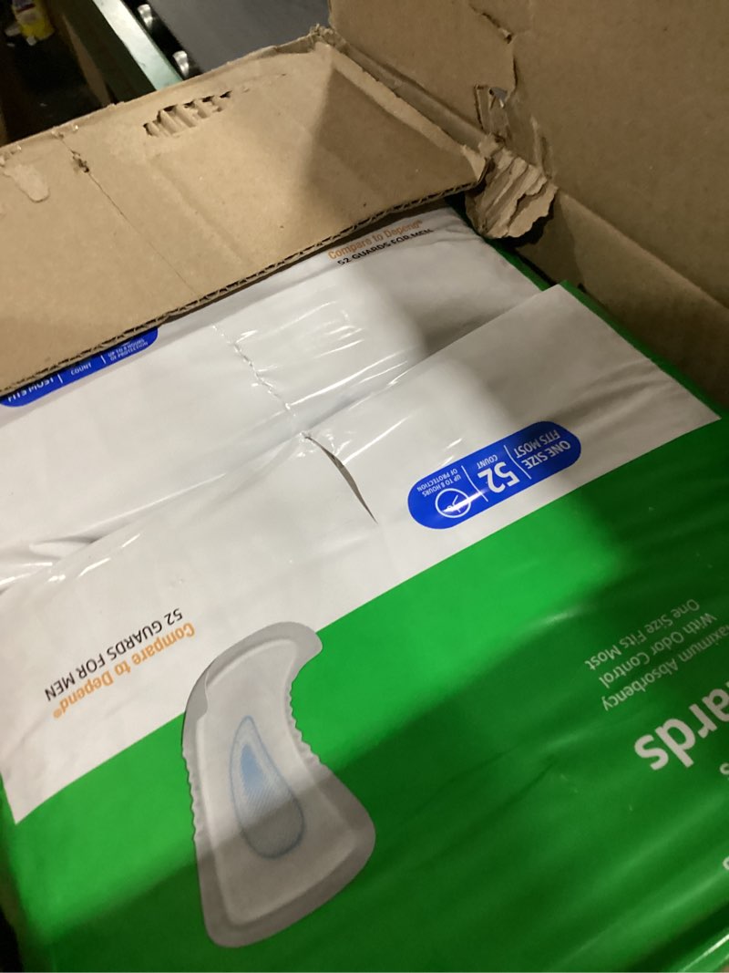 Condition photo showing As Is for Amazon Basics Men's Incontinence Guards, Maximum Absorbency, 52 Count, (1 Pack of 52)