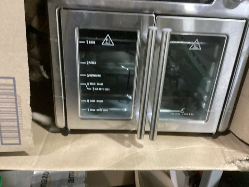 Condition photo showing As Is for Dan - Emeril Lagasse Extra Large French Door Air Fryer Toaster Oven Combo, 24 Cooking Functions and Digital Controls, 7 Accessories Included, Stainless Steel Finish, 26QT Capacity
