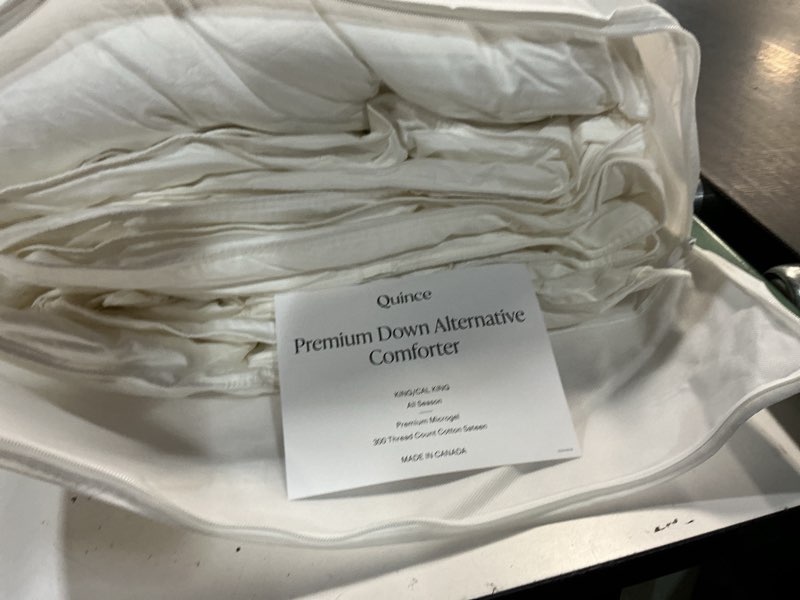 Condition photo showing As Is for quince premium down alternative comforter king/cal king all season premium microgel