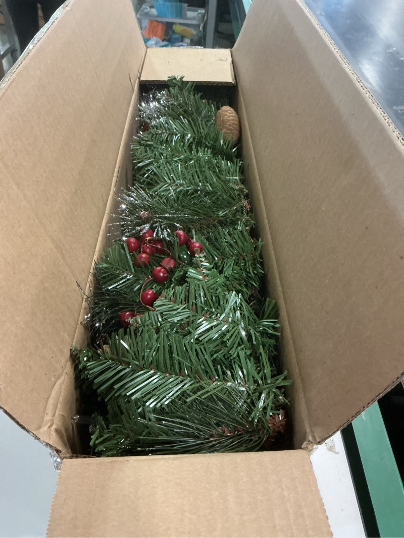 Condition photo showing Good Condition for National Tree Company 9 ft Pre-Lit Crestwood Spruce Artificial Christmas Garland, Christmas Decoration with Glitter, Pinecones, Red Berries, 50 Clear Lights, 180 Tips, Green Plug In Tree