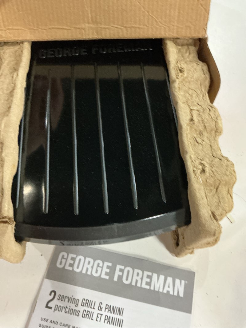 Condition photo showing New/Like New for george foreman 2-serving classic plate electric indoor grill and panini press, black, grs040b