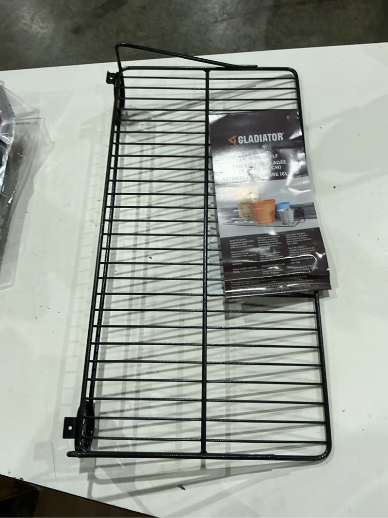 Condition photo showing Good Condition for garage storage 24 in. w x 13 in. d wire shelf for geartrack channels and gearwall panels