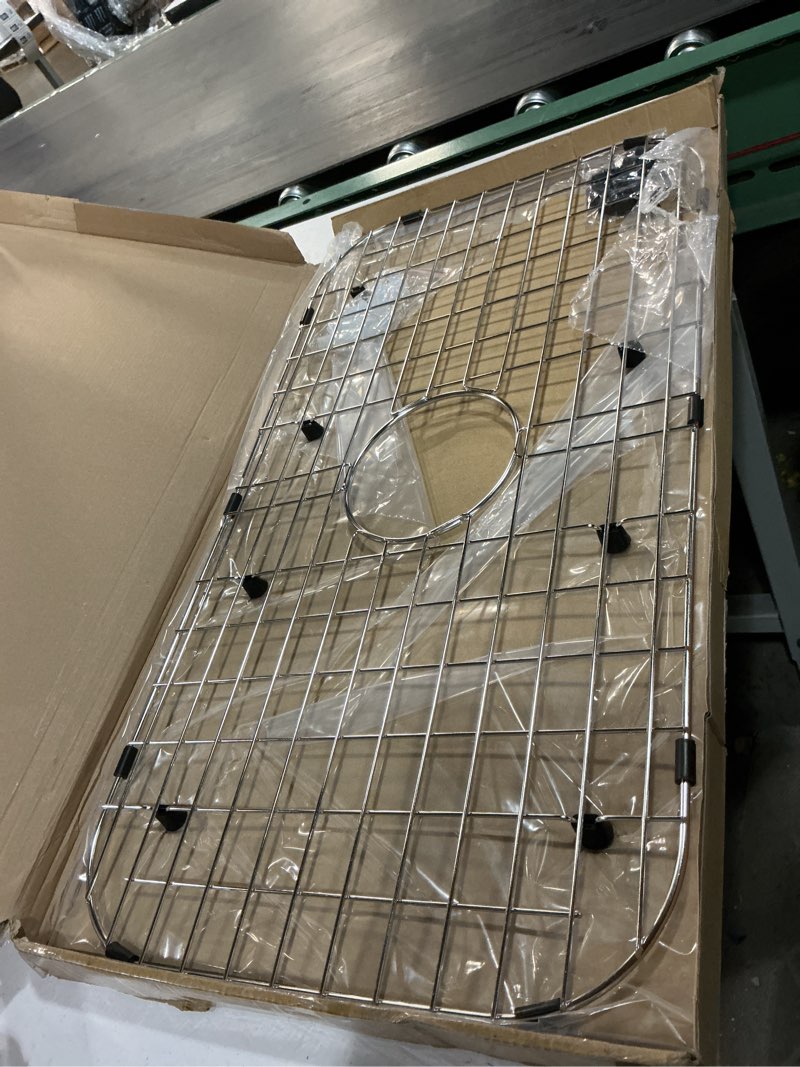Condition photo showing Good Condition for serene valley sink protector grid 26-1/16" x 14-1/16", centered drain with corner radius 3-1/2", 304 stainless steel material nlw2614c