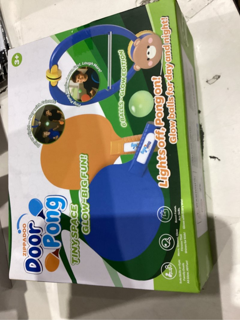 Condition photo showing New/Like New for Glow-in-The-Dark Door Pong Ping Pong Trainer with 6 Rechargeable Balls - Door Frame Hanging Table Tennis Set, Indoor Outdoor Fun Ages 3+