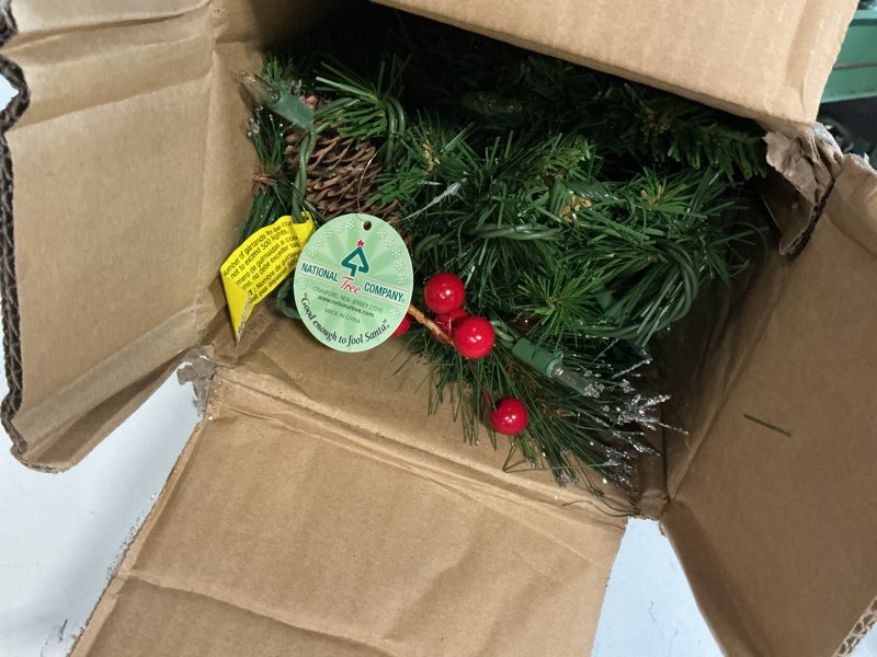 Condition photo showing New/Like New for National Tree Company 9 ft Pre-Lit Crestwood Spruce Artificial Christmas Garland, Christmas Decoration with Glitter, Pinecones, Red Berries, 50 Clear Lights, 180 Tips, Green Plug In Tree