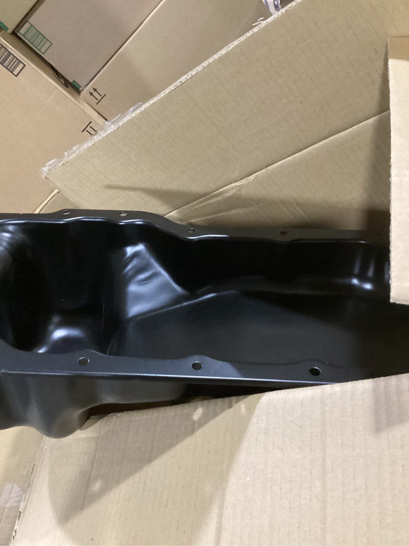 Condition photo showing As Is for dorman 264-260 engine oil pan compatible with select dodge / ram models