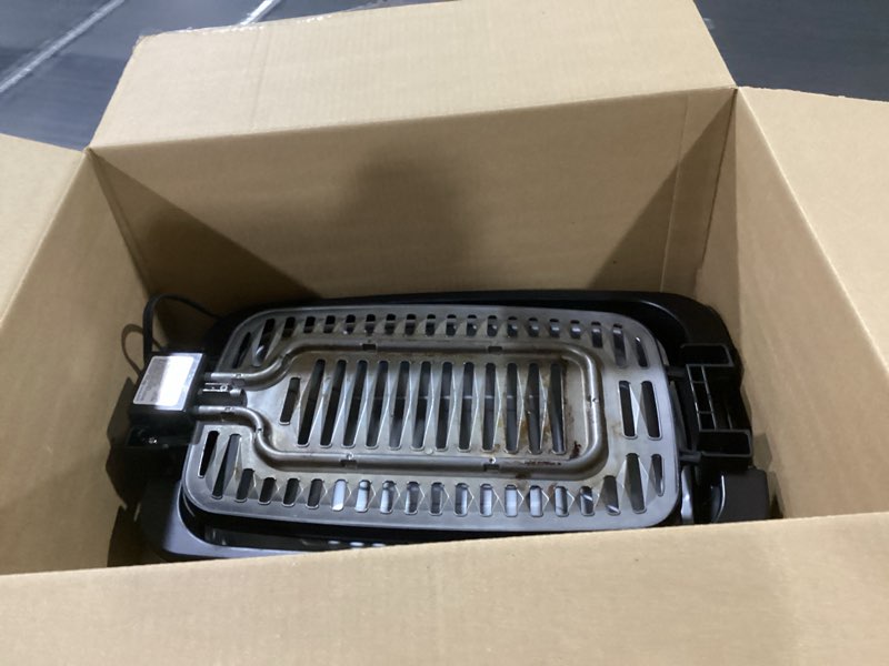 Condition photo showing As Is for chefman smokeless indoor electric grill, extra large grilling surface, nonstick table top grill for indoor grilling and bbq with adjustable temperature control, drip tray, dishwasher-safe parts