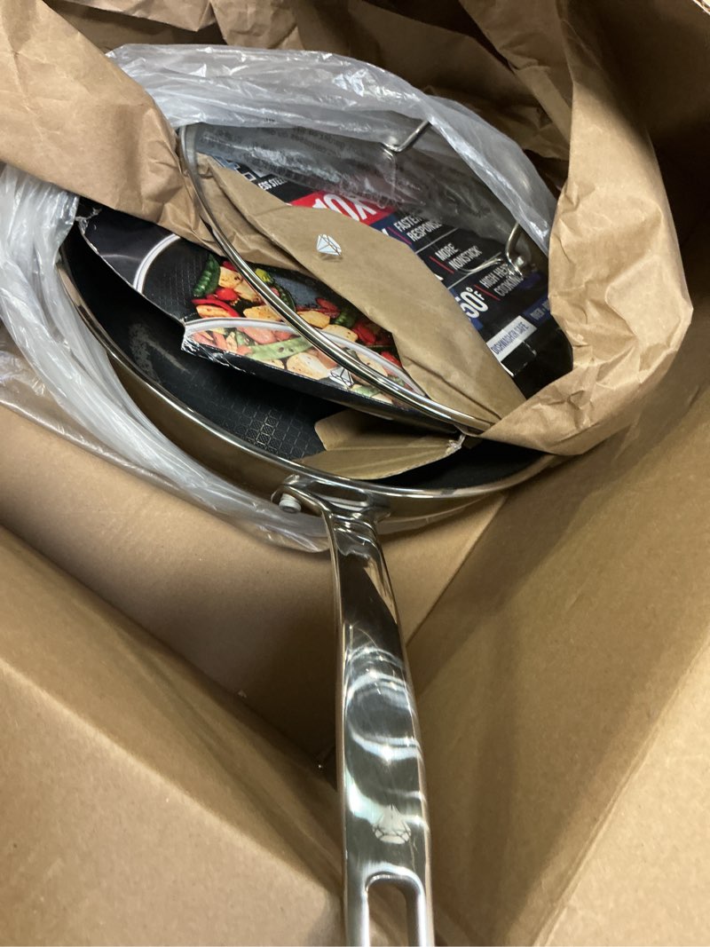 Condition photo showing As Is for Blue Diamond Hybrid Nonstick Stainless Steel 12” Wok with Lid, PFAS-Free Ceramic Diamond Bond Stir-Fry Pan, Induction Ready, Dishwasher & Oven Safe, Metal Utensil Safe, Stay-Cool Handle, Silver 12" Wok Pan with Lid Silver