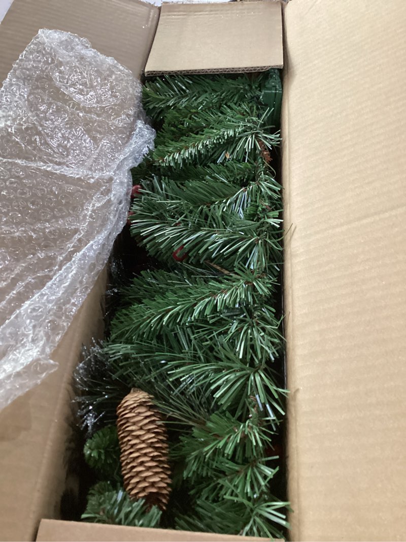 Condition photo showing New/Like New for national tree company 9 ft pre-lit crestwood spruce artificial christmas garland, christmas decoration with glitter, pinecones, red berries, 50 warm white led lights, 180 tips, timer, green battery operated tree