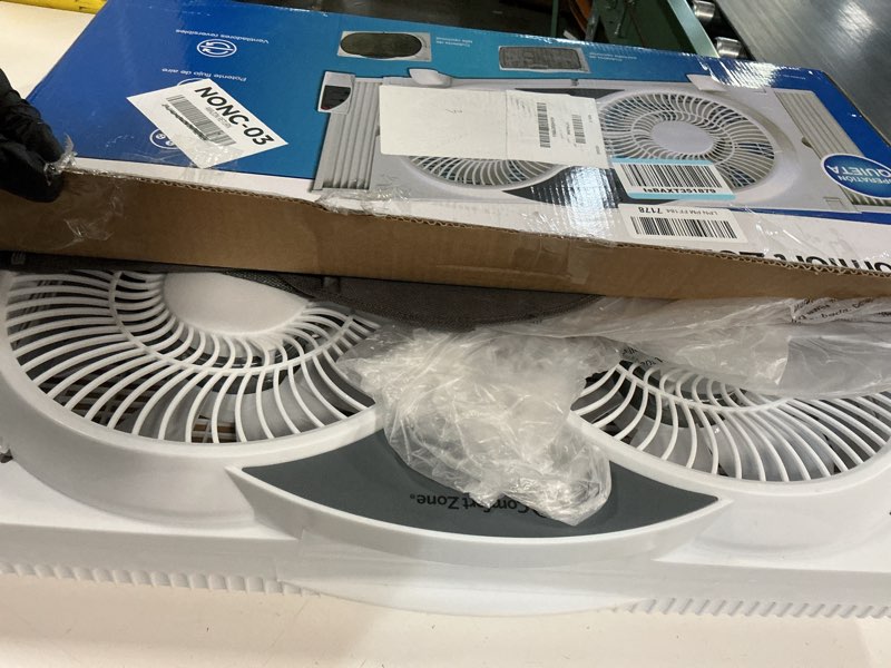 Condition photo showing As Is for comfort zone 9  3-speed reversible twin window fan with remote control  white