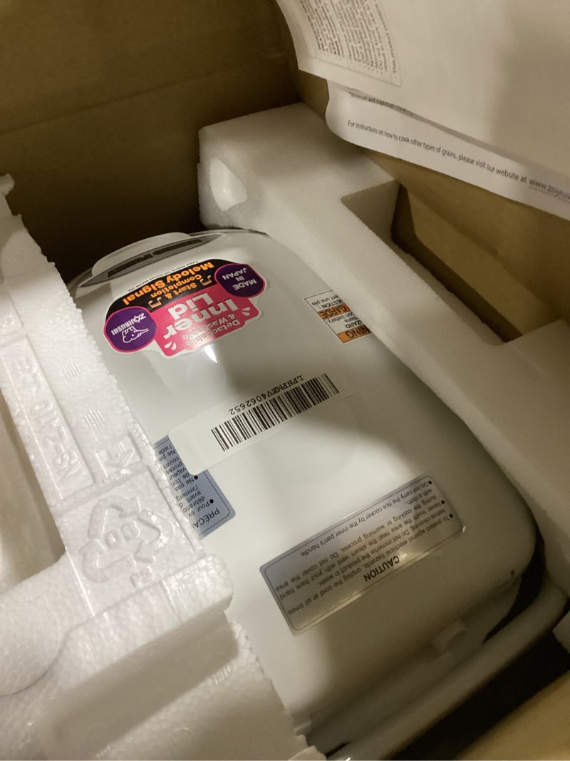 Condition photo showing Good Condition for Zojirushi NS-ZCC10 5-1/2-Cup Neuro Fuzzy Rice Cooker and Warmer, Premium White 5.5-Cup uncooked rice