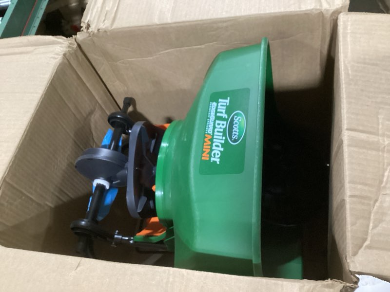 Condition photo showing Good Condition for Scotts Turf Builder EdgeGuard Mini Broadcast Spreader for Seed, Weed and Feed, Fertilizer, Salt, Ice Melt, Push Spreader Holds up to 5,000 sq.ft. Product