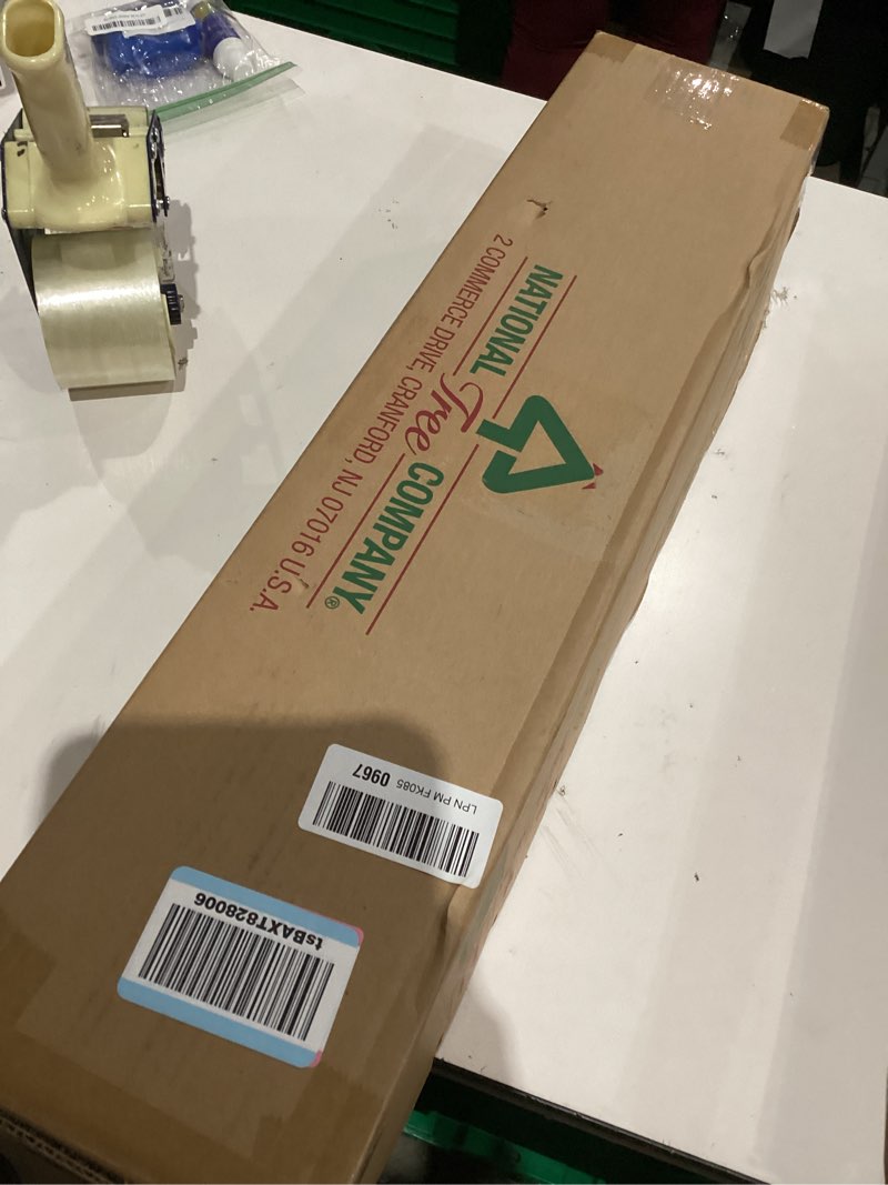 Condition photo showing As Is for National Tree Company 9 ft Pre-Lit Crestwood Spruce Artificial Christmas Garland, Christmas Decoration with Glitter, Pinecones, Red Berries, 50 Clear Lights, 180 Tips, Green Plug In Tree