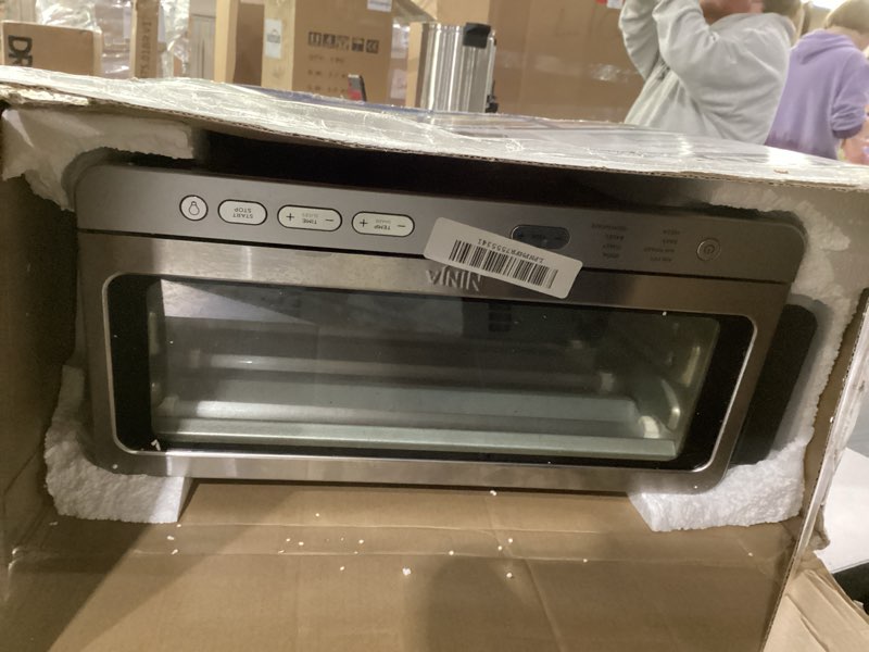 Condition photo showing As Is for not tested ***ninja air fryer toaster oven combo | 8-in-1 functionality | flip up & away for storage space | air fry basket, sheet pan, wire rack & removable crumb tray |1800 watt | stainless steel | sp151 stainless premium 8-in-1 flip oven