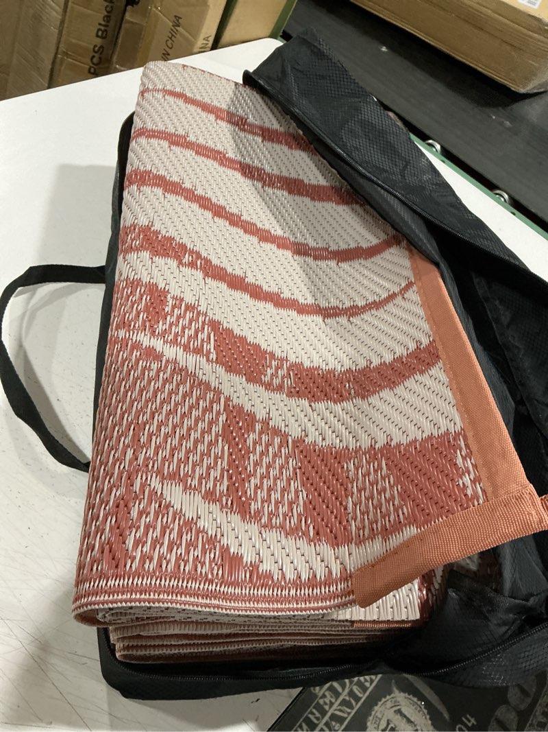Condition photo showing Good Condition for genimo outdoor rug 5' x 8' waterproof for patios clearance, reversible plastic straw camping carpet, large area rugs mats for rv, picnic, backyard, deck, balcony, porch, beach, brick&red brick & red | waterproof 5' x 8' (rectangular)