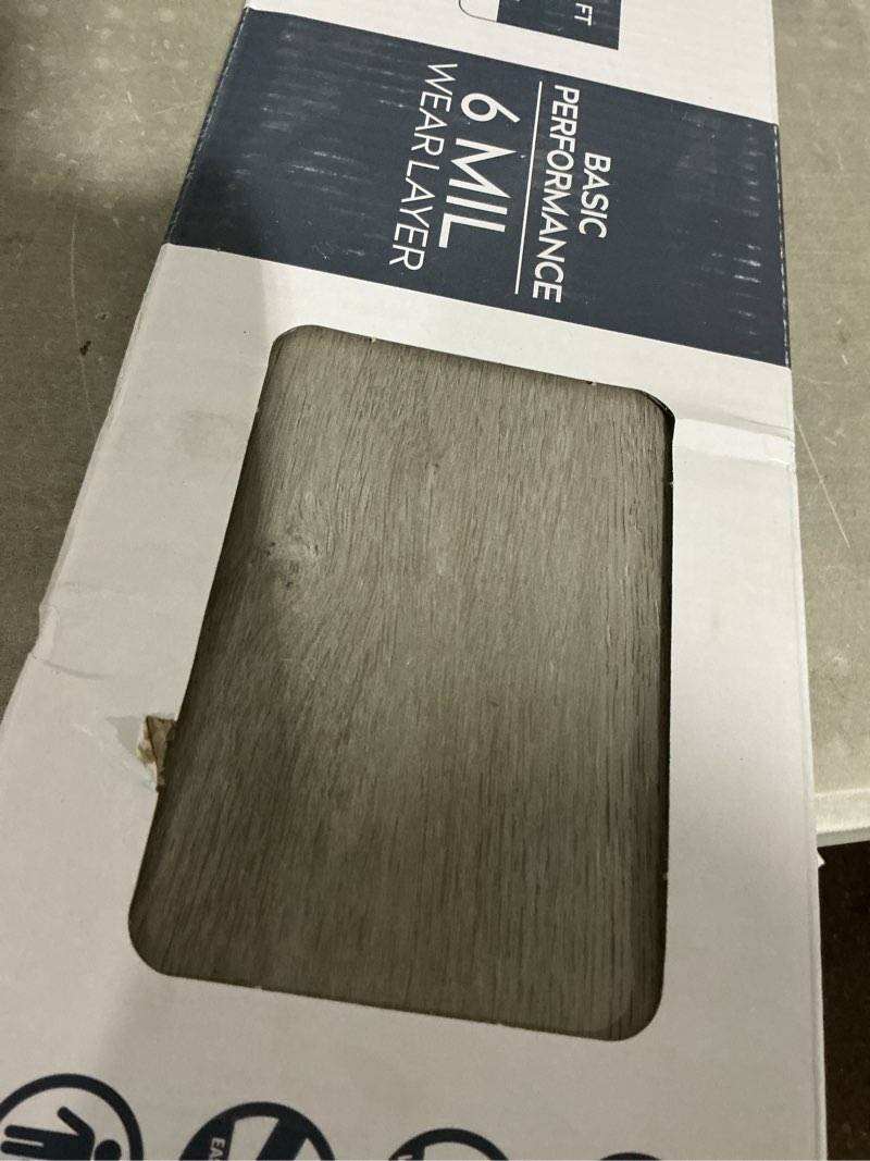 Condition photo showing As Is for style selections slate oak gray 6-mil x 6-in w x 36-in l waterproof interlocking luxury vinyl plank flooring (22.17-sq ft/ carton)