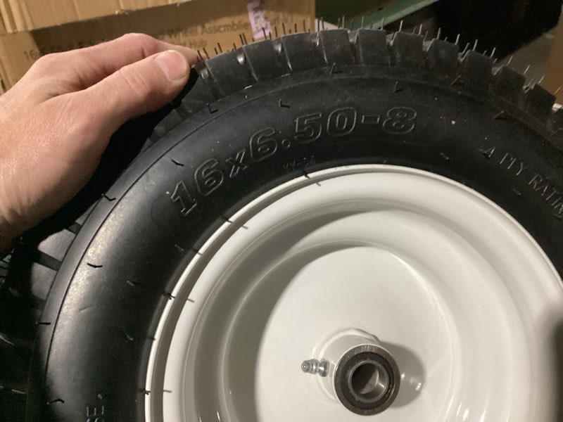 Condition photo showing New/Like New for two trailer or lawn mower tires