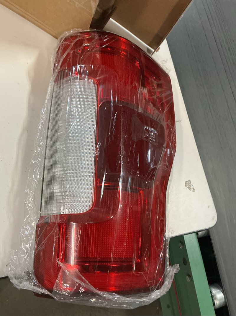 Condition photo showing As Is for (Similar to stock photo) OEM Style Tail Light; Chrome Housing; Red/Clear Lens; Passenger Side (17F25-005 R )