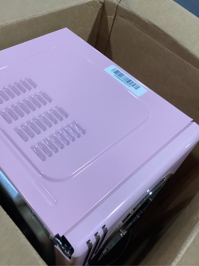 Condition photo showing As Is for Nostalgia Retro Countertop Microwave Oven - 1.1 Cu Ft & 1000 Watt Power- Easy to Clean with Removable Glass Turntable - Child Safety Lock - 12 Programs - Digital Clock - Pink Retro Classic 1.1 Cu. Ft. Pink