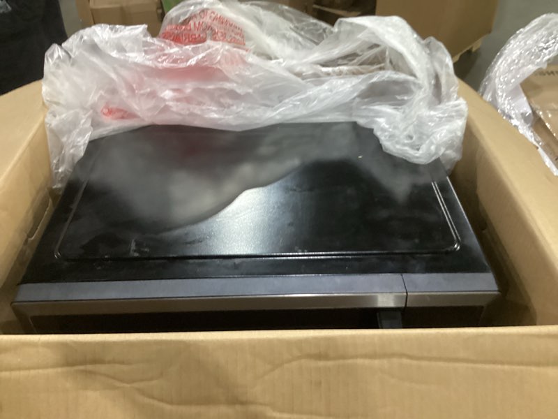 Condition photo showing As Is for not tested**** toshiba air fryer combo 8-in-1 countertop microwave oven, with convection, broil, odor removal mode, 12.4\" position memory turntable, child-lock, 1.0 cu.ft, black stainless steel, ml2-ec10sa(bs)