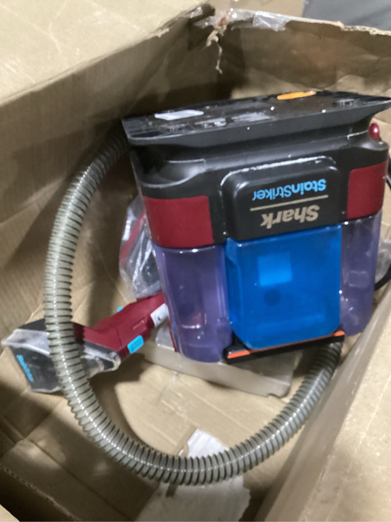 Condition photo showing As Is for shark stainstriker portable carpet & upholstery cleaner w/on board self cleaning - spot, stain, & odor eliminator, includes 2 cleaning tools & 2 cleaning solutions, charcoal, px221brn stainstriker w/ onboard self-cleaning